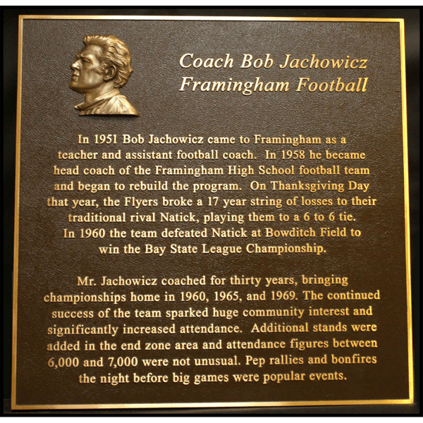 photo of bronze-colored plaque with small relief portrait of Bob Jachowicz in top left corner