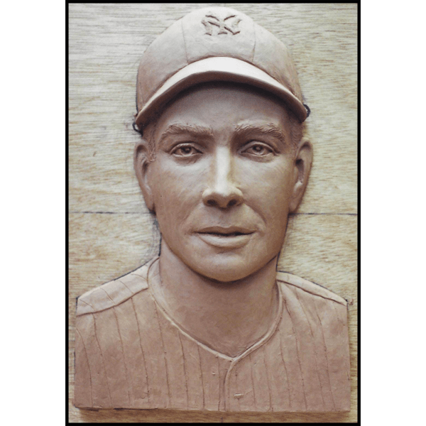 photo of clay model of portrait relief sculpture of Joe DiMaggio on wood backing