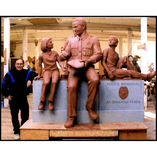 photo of clay model of sculpture of adult with two children on bench mockup