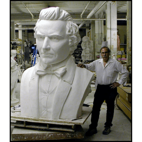 photo of Robert Shure with monumental plaster bust of Donald McKay