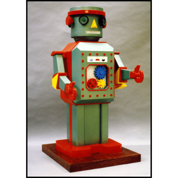 photo of sculpture of robot toy with polychrome finish on gray background