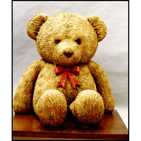 photo of sculpture of teddy bear with polychrome finish on gray background