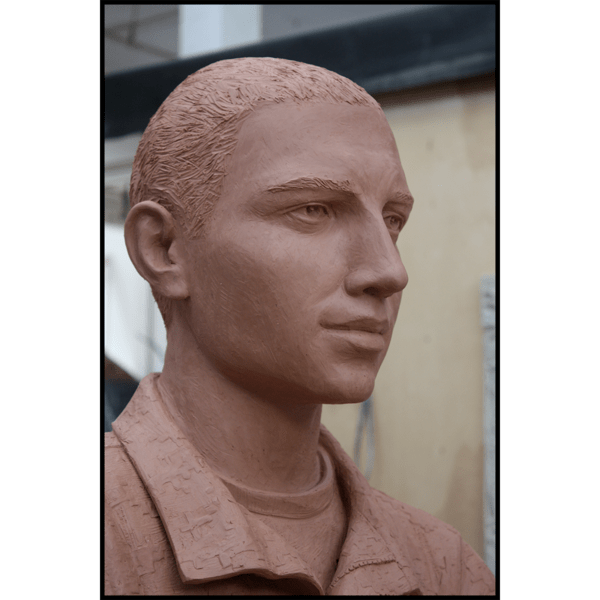 closeup photo of face of clay model of sculpture of Johnny Roberge
