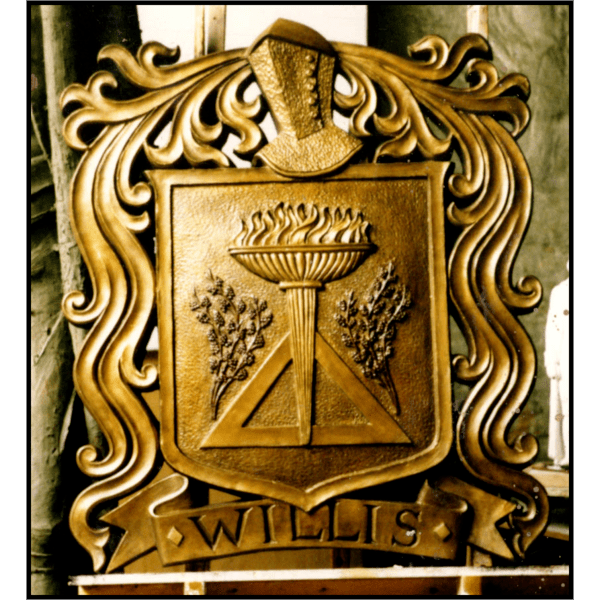 photo of bronze relief cartouche of family seal on wood easel