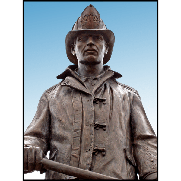 detail photo of bronze statue of standing firefighter holding an ax