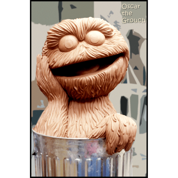 photo of clay model of sculpture of Oscar the Grouch in a trash can