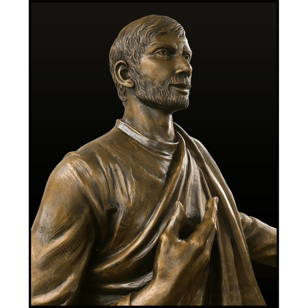 photo detail of bronze sculpture of man in robes seated with one hand raised to heart against black background