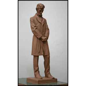 photo of clay model sculpture of Abraham Lincoln standing with hands clasped at his waist