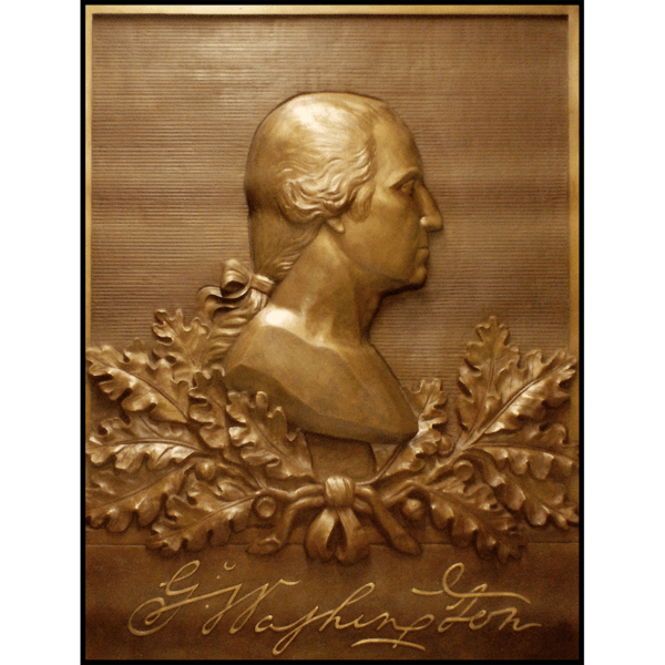 photo of bronze relief portrait of George Washington in profile with oak leaves and his signature