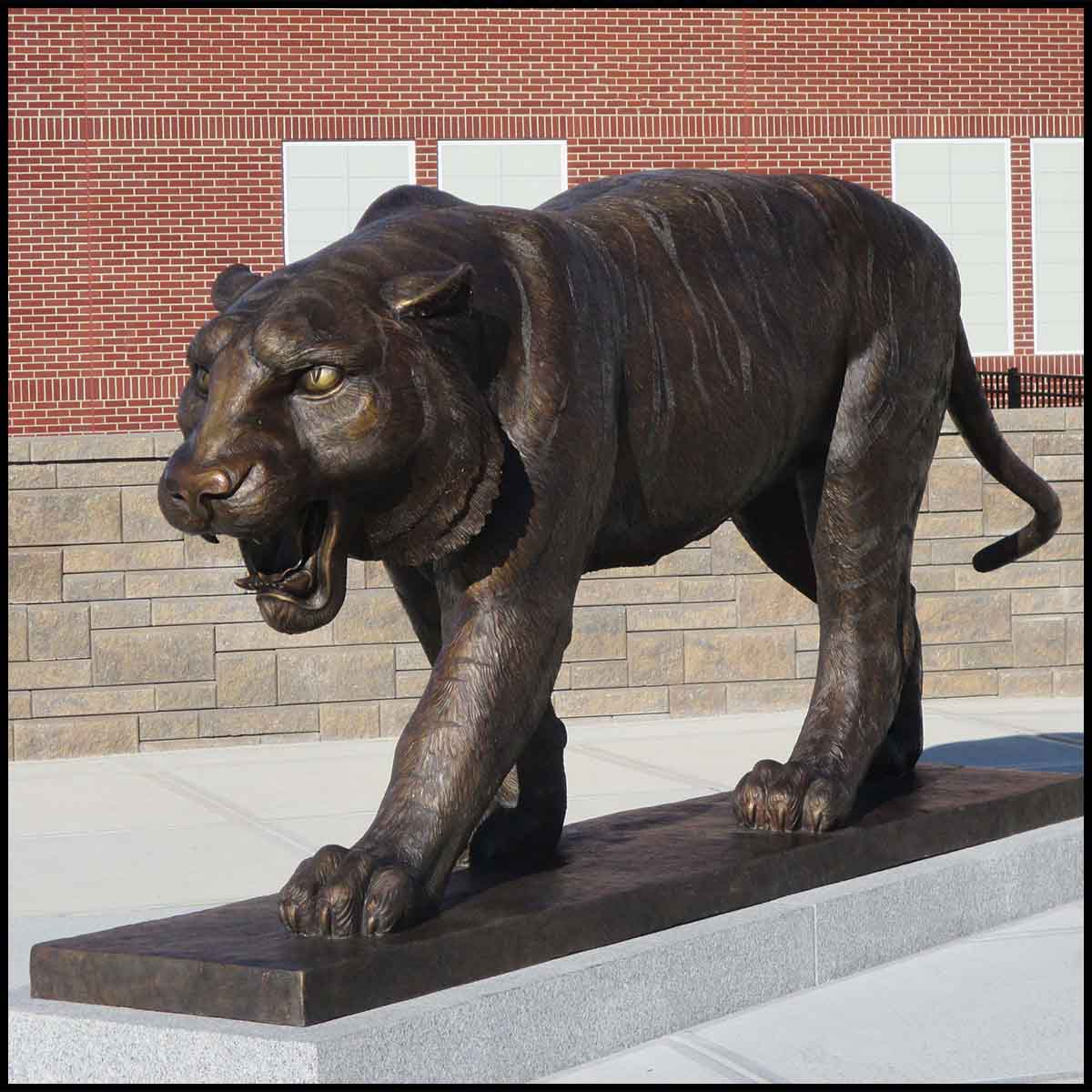 photo of bronze sculpture of tiger