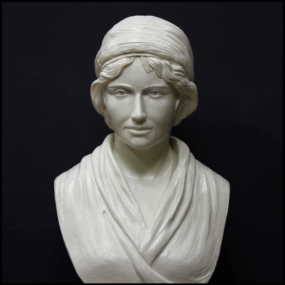 white plaster bust of female, namely Mary Wollstonecraft, against gray background