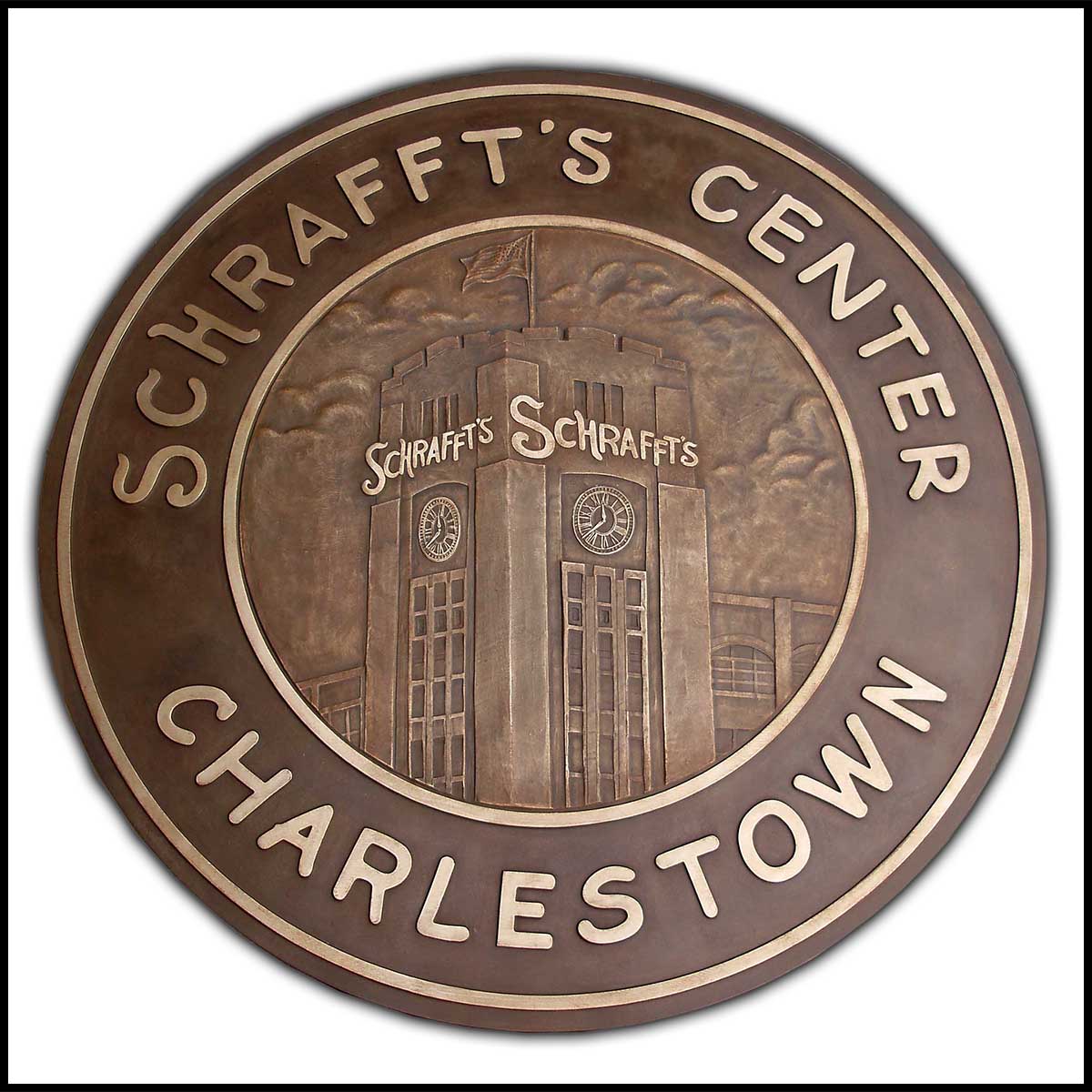 photo of bronze floor medallion with relief sculpture of Schrafft's building and text